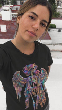 Load and play video in Gallery viewer, Floral Angel Skeleton Shirt - Neon Rose Winged Skull Tee - Vintage Unisex Day of the Dead T-Shirt - Back to School Goth Streetwear